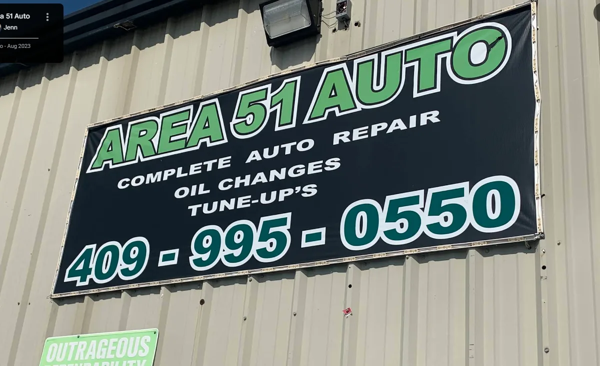 The big green Area 51 Auto sign on the shop
