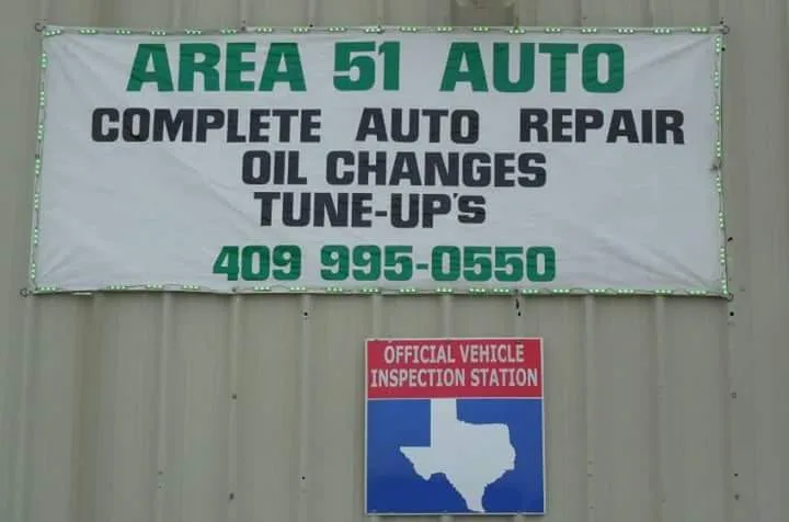 Area 51 Auto banner above the Official Vehicle Inspection Station sign